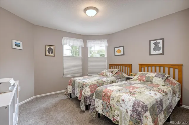 a bedroom with a bed and lamp