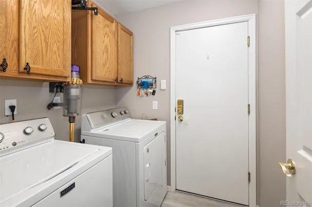 a view of storage and utility room with washer and dryer
