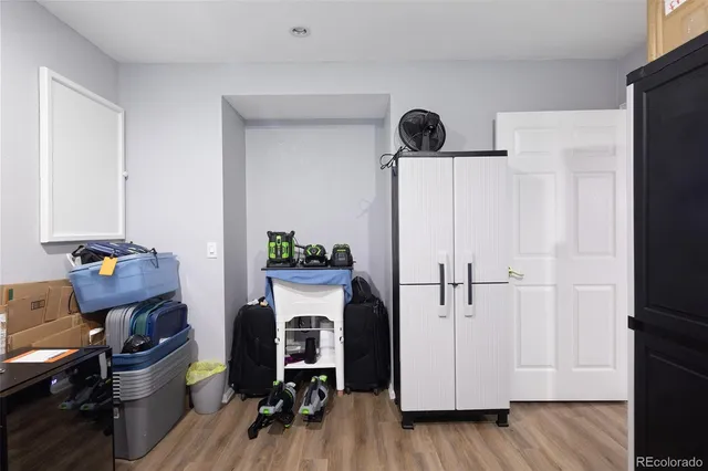 a view of room with furniture and wooden floor