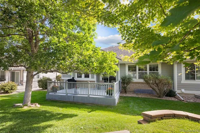 a view of a house with a yard porch and sitting area