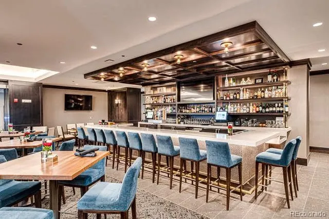 a large kitchen with a table and chairs