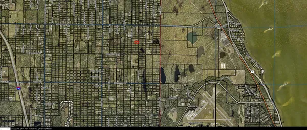 a aerial view of a house with a yard