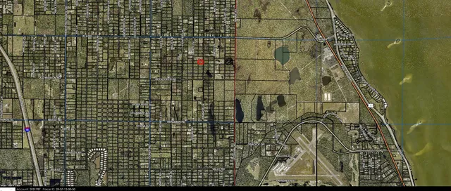 a aerial view of a house with a yard