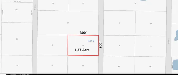 an aerial view of a residential houses with outdoor space and street view