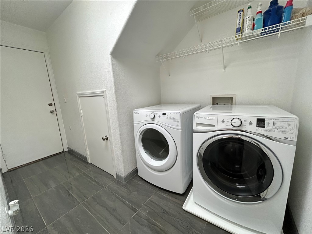 6538 Elm Spring Las Vegas, NV 89148 - Photo 23 of 29 Functional utility space with durable tile flooring and convenient storage shelves.
