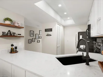 a bedroom with a bed and a chair