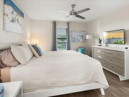 a large white bed in a white room