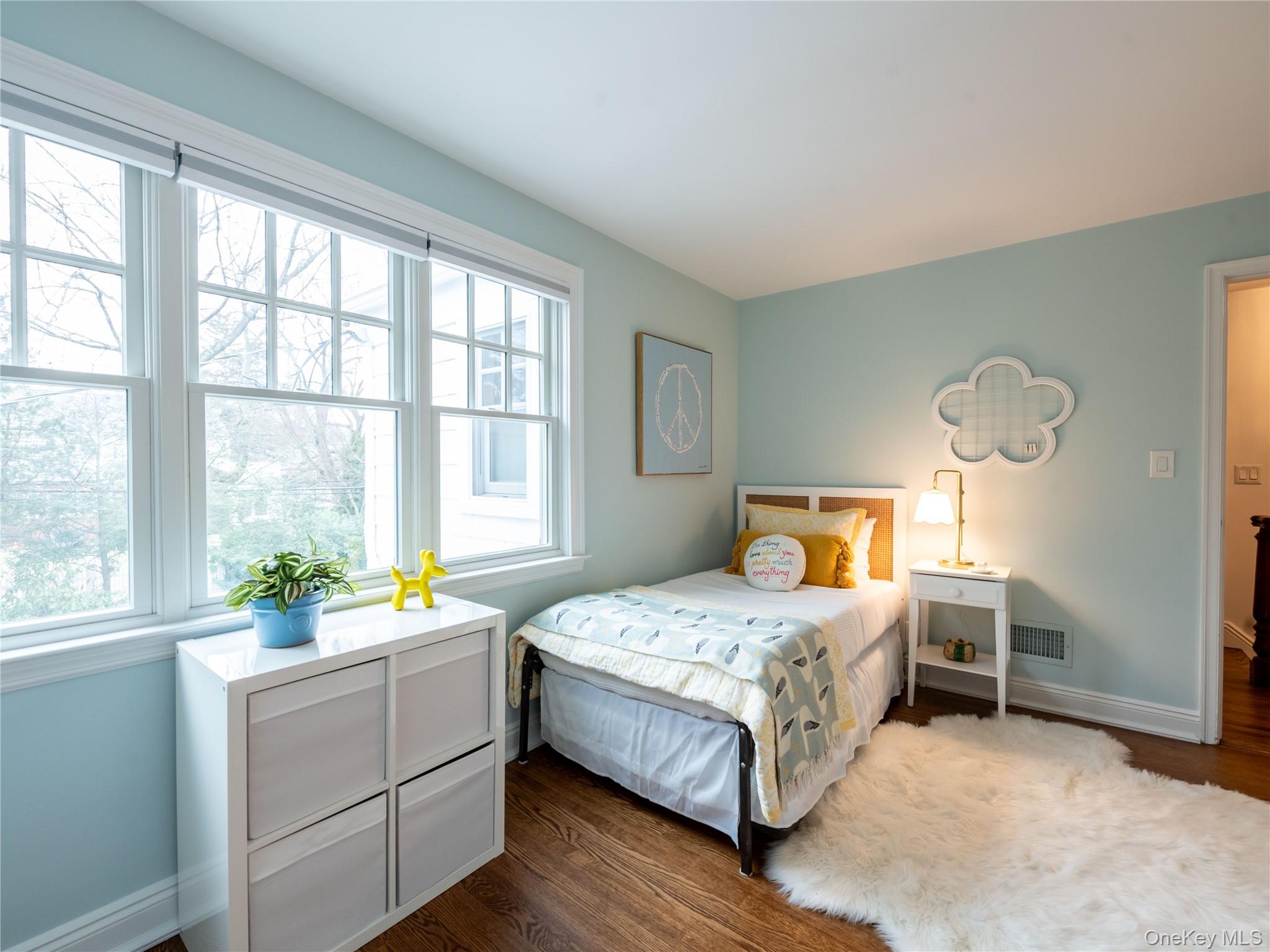 126 Northwoods Road Manhasset, NY 11030 - Photo 15 of 26 a bedroom with a bed and a window