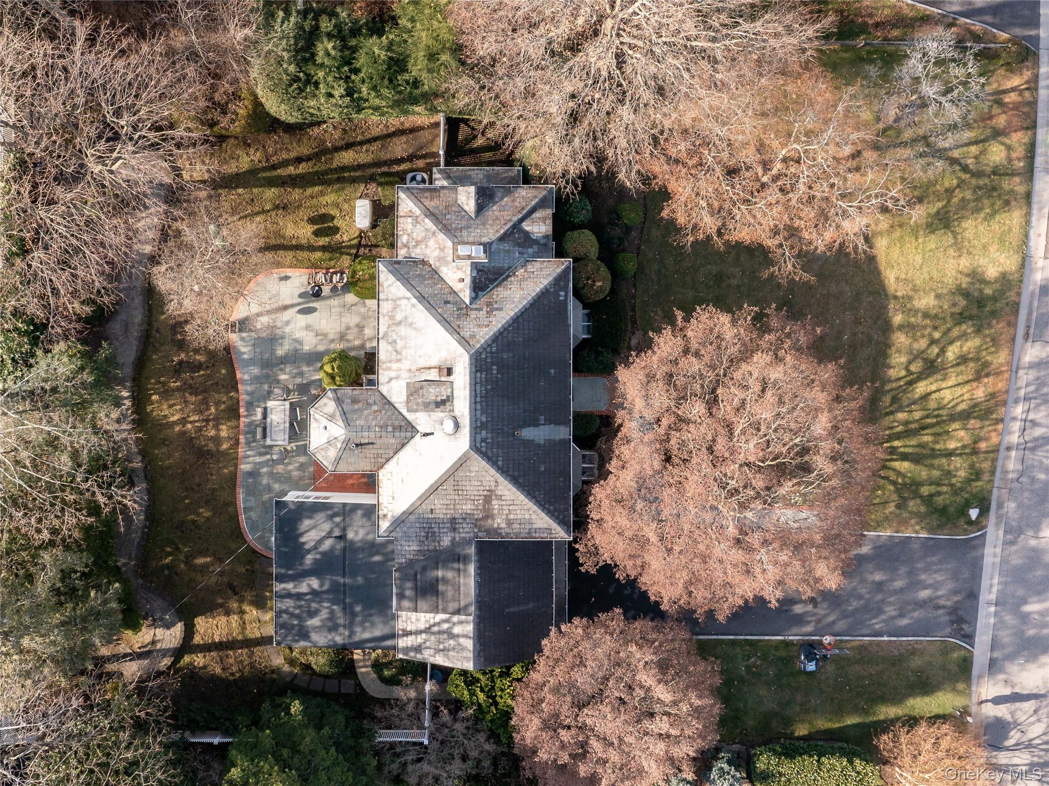 126 Northwoods Road Manhasset, NY 11030 - Photo 22 of 26 an aerial view of a house with a yard