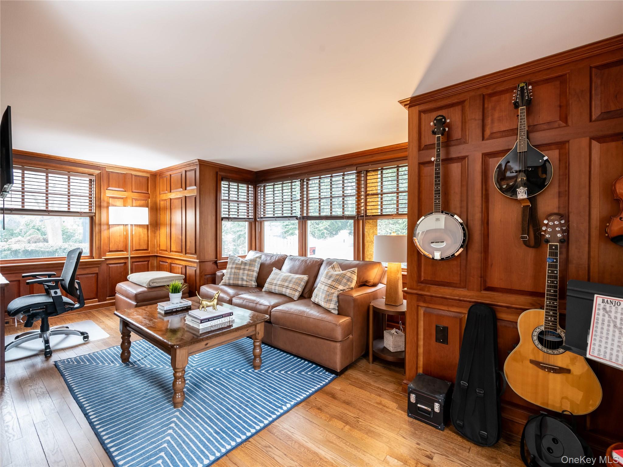 126 Northwoods Road Manhasset, NY 11030 - Photo 6 of 26 a living room with furniture a rug and a window