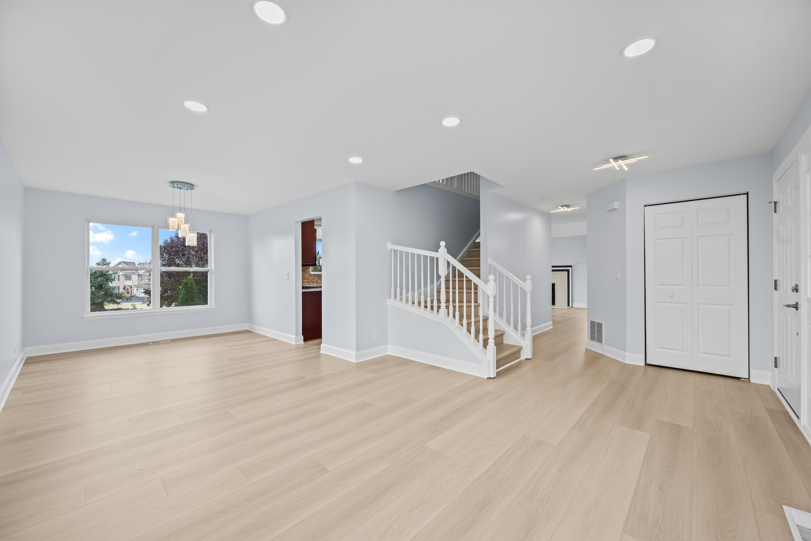 400 Diamond Back Way Algonquin, IL 60102 - Photo 3 of 23 a view of an empty room with stairs and a window