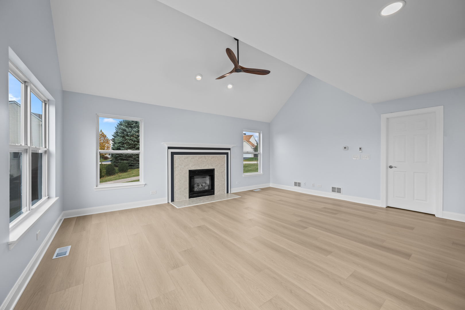 400 Diamond Back Way Algonquin, IL 60102 - Photo 8 of 23 an empty room with windows fireplace and a sink