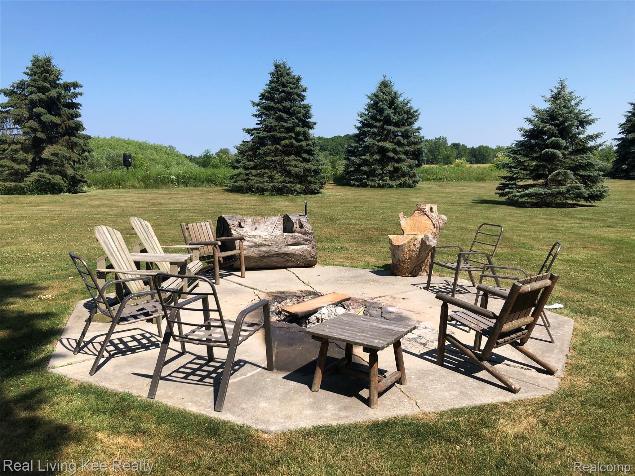 5775 McIntyre Road North Street, MI 48049 - Photo 3 of 65 5775 McIntyre exterior photos 7 2 2020 2 fire pit.jpg
