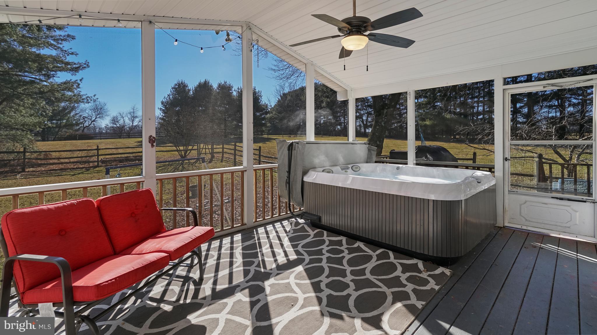 14931 Old York Road Phoenix, MD 21131 - Photo 22 of 25 Enclosed rrear screened porch with hottub
