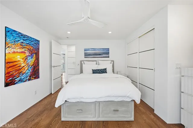 a kitchen with stainless steel appliances granite countertop a table chairs sink and cabinets