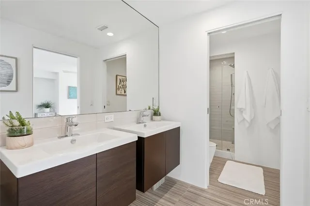 a large kitchen with granite countertop a sink and a refrigerator