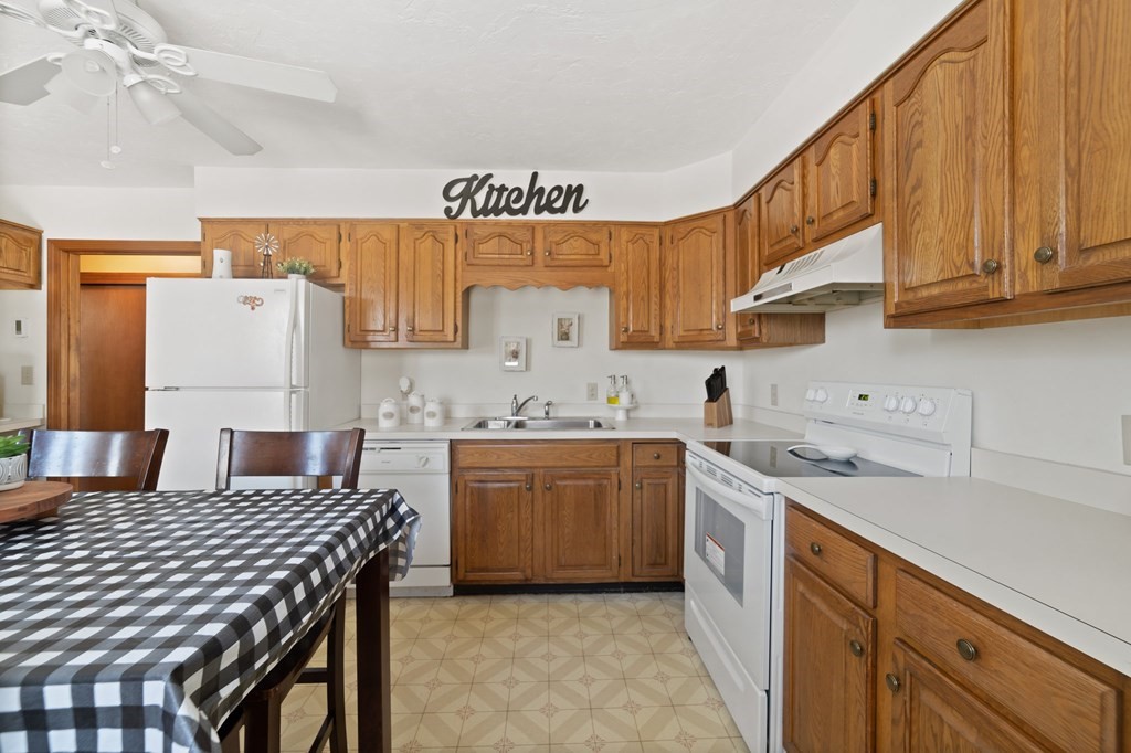 100 Barry Road Worcester, MA 01609 - Photo 15 of 37 a kitchen with a sink refrigerator and cabinets