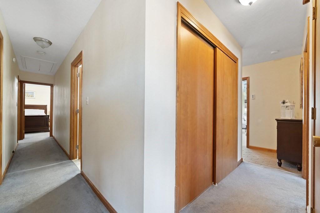 100 Barry Road Worcester, MA 01609 - Photo 19 of 37 a view of a hallway with wooden shelves