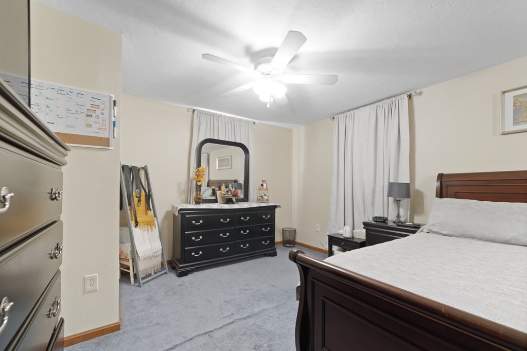100 Barry Road Worcester, MA 01609 - Photo 23 of 37 a bedroom with a bed and a dresser