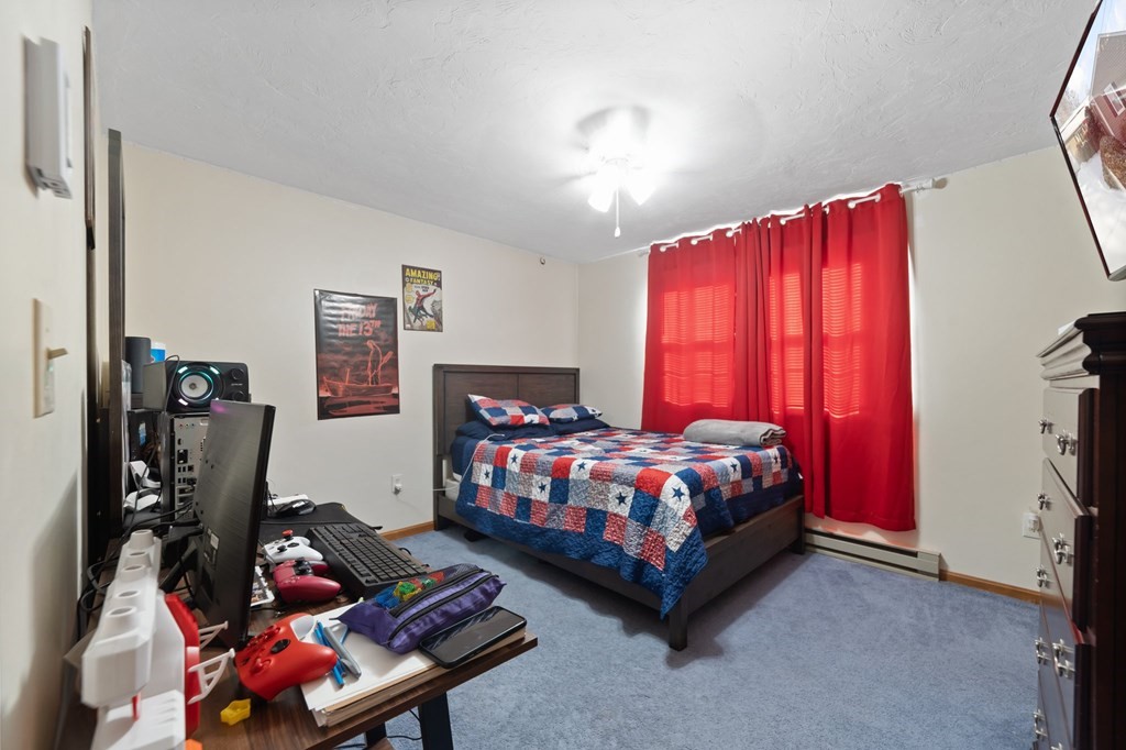 100 Barry Road Worcester, MA 01609 - Photo 26 of 37 a bedroom with a bed chair and window