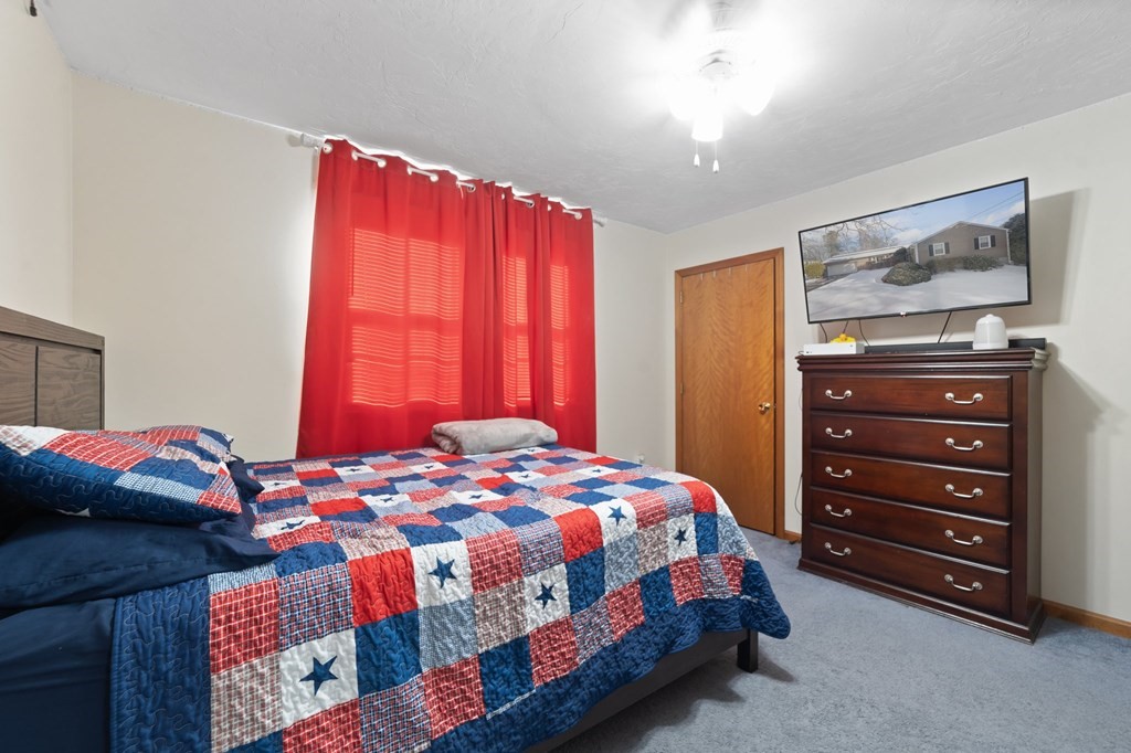 100 Barry Road Worcester, MA 01609 - Photo 27 of 37 a bedroom with a bed and a dresser