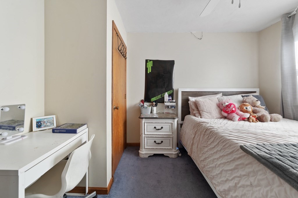 100 Barry Road Worcester, MA 01609 - Photo 29 of 37 a bedroom with a bed and a flat tv screen on dresser