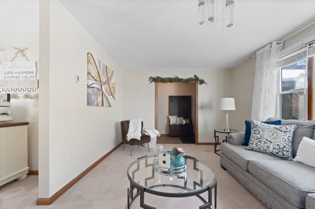 100 Barry Road Worcester, MA 01609 - Photo 8 of 37 a living room with furniture and a table