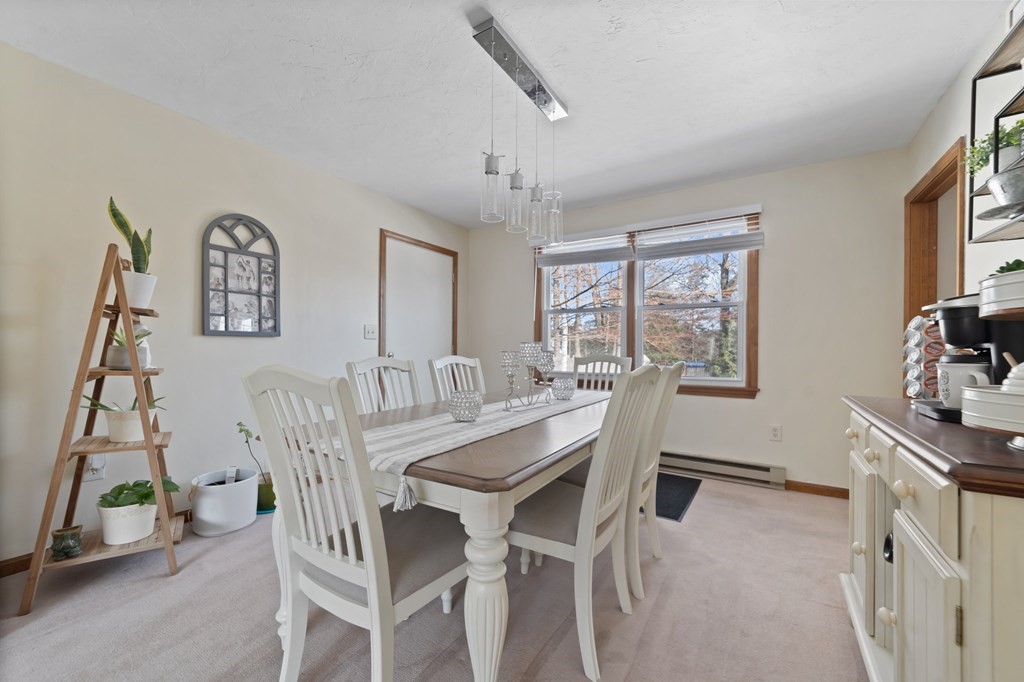 100 Barry Road Worcester, MA 01609 - Photo 10 of 37 a view of a dining room with furniture and a window
