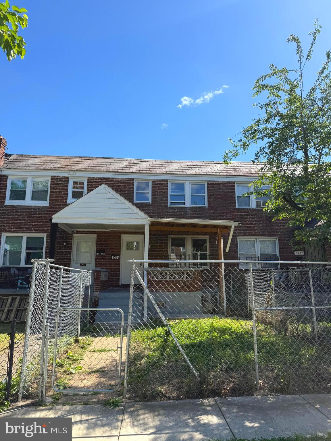 1353 Cambria Street Baltimore, MD 21225 - Photo 2 of 23 a front view of a house with garden