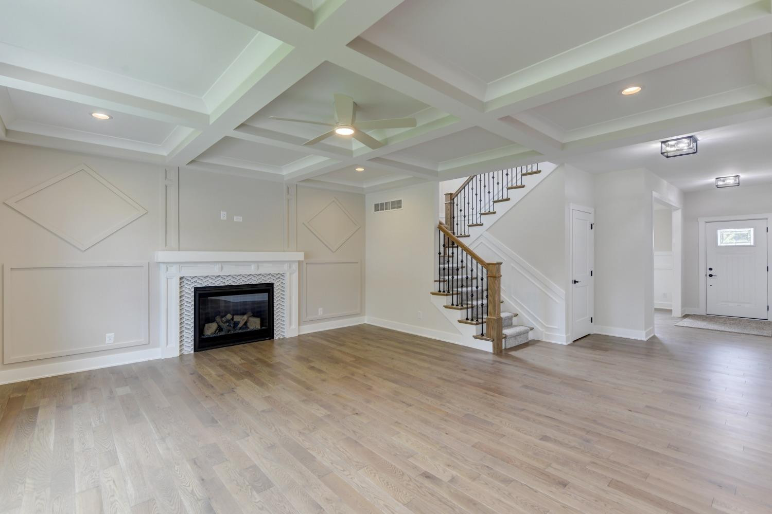 8147 Castle Drive Munster, IN 46321 - Photo 3 of 37 an empty room with wooden floor and fireplace