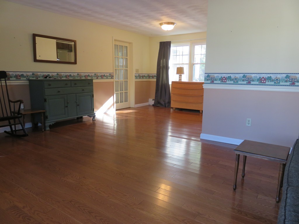 26 Clarissa Road Chelmsford, MA 01824 - Photo 3 of 20 a view of a livingroom with furniture wooden floor and windows