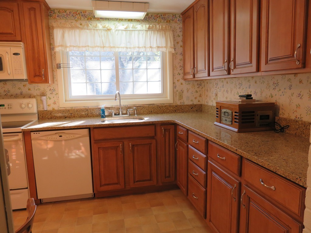 26 Clarissa Road Chelmsford, MA 01824 - Photo 5 of 20 a kitchen with granite countertop cabinets sink and window