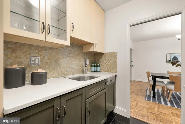 a kitchen with a stove and a sink