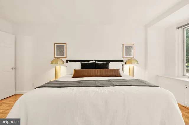 a bedroom with a bed and a couch