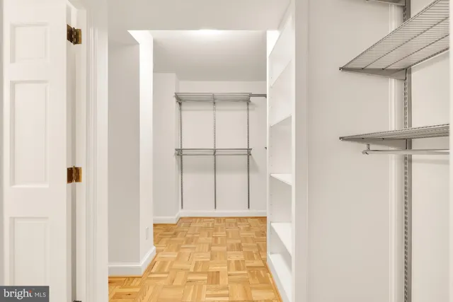 a bathroom with a sink mirror toilet and shower