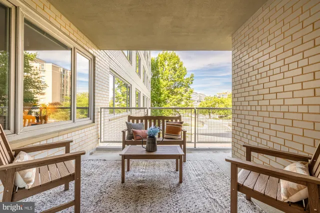 a living room filled with furniture and a window