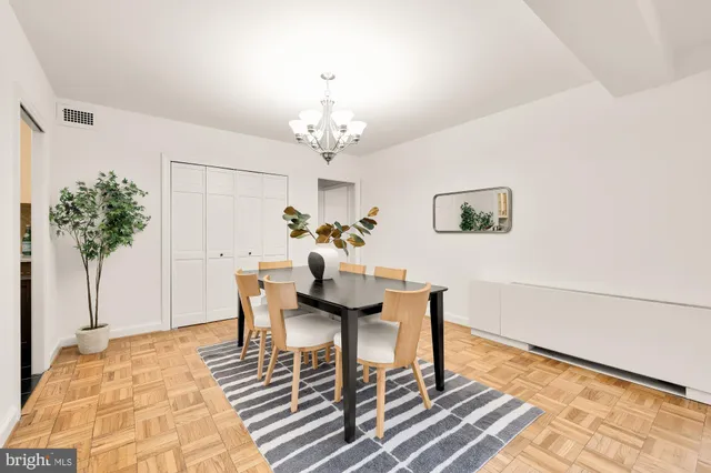 a kitchen with stainless steel appliances a sink stove and cabinets