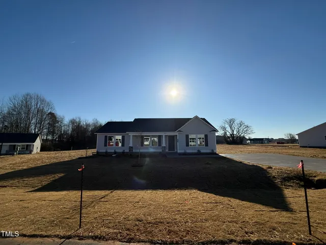 a view of a lake in front of the house