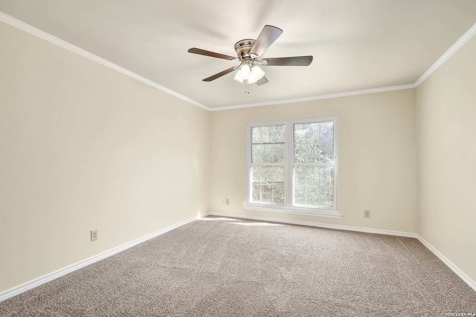13130 Blanco Road, Unit 1706 San Antonio, TX 78216 - Photo 11 of 23 an empty room with a window and a fan