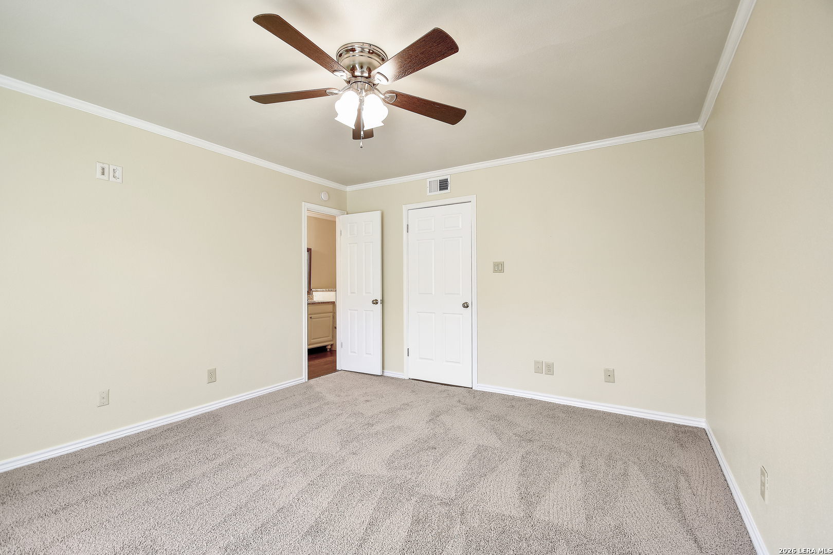 13130 Blanco Road, Unit 1706 San Antonio, TX 78216 - Photo 12 of 23 an empty room with a ceiling fan and a window