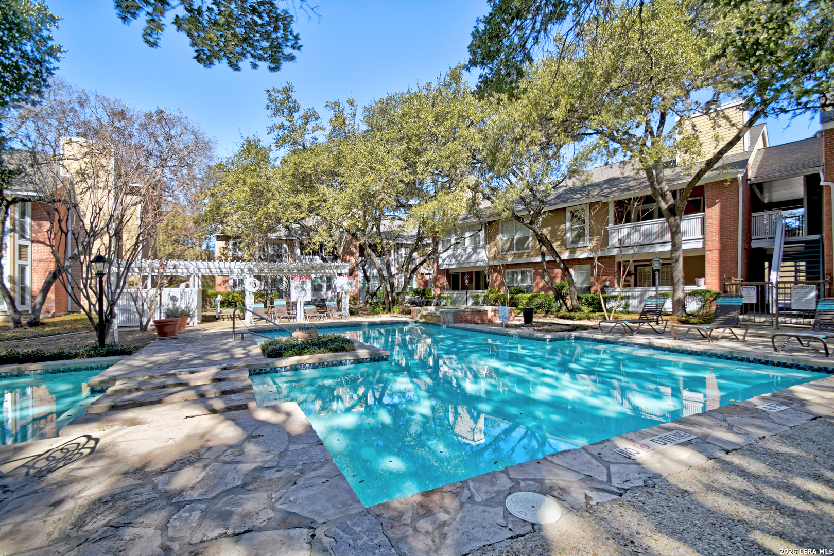 13130 Blanco Road, Unit 1706 San Antonio, TX 78216 - Photo 18 of 23 a view of a yard with swimming pool