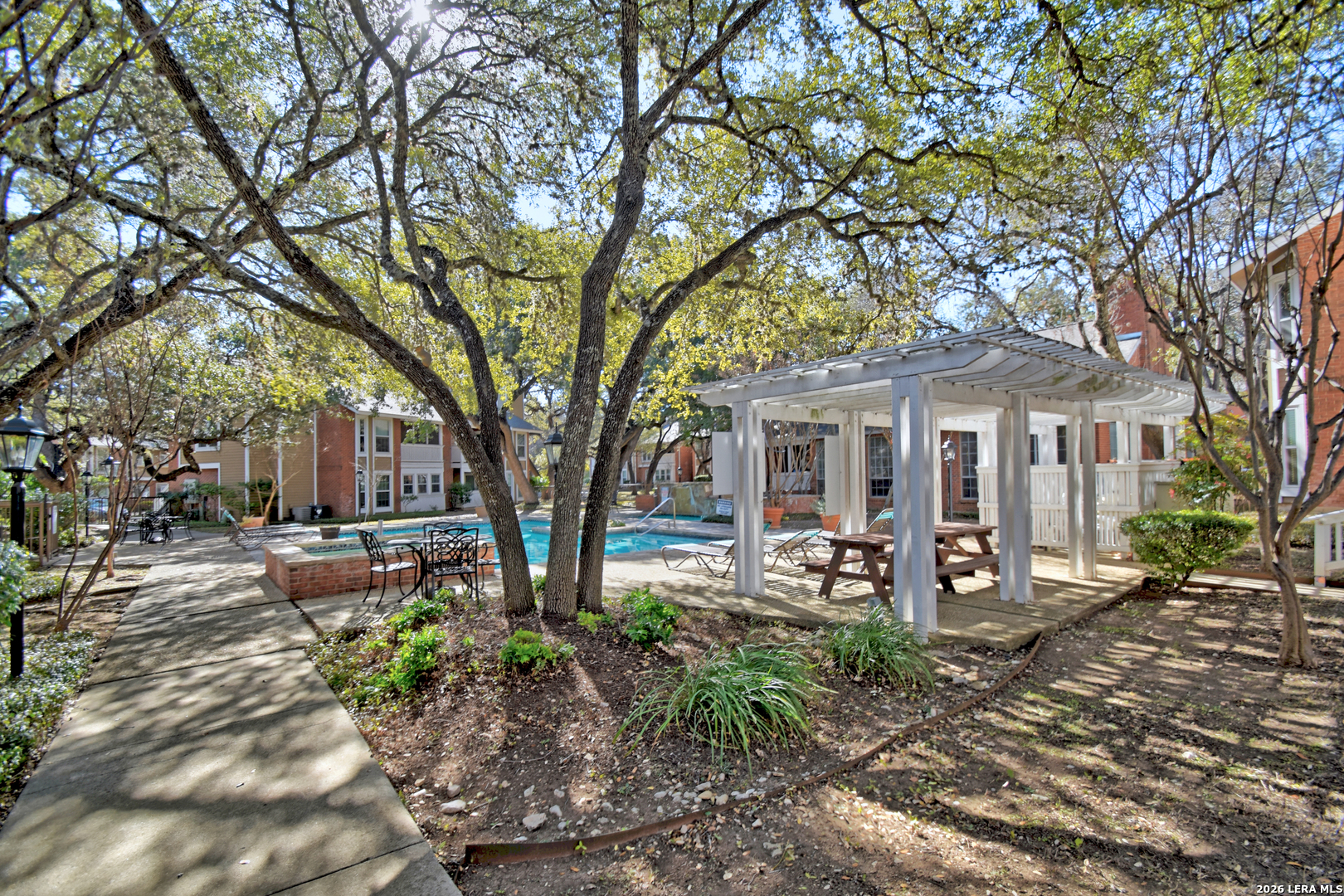 13130 Blanco Road, Unit 1706 San Antonio, TX 78216 - Photo 19 of 23 a front view of a house with garden