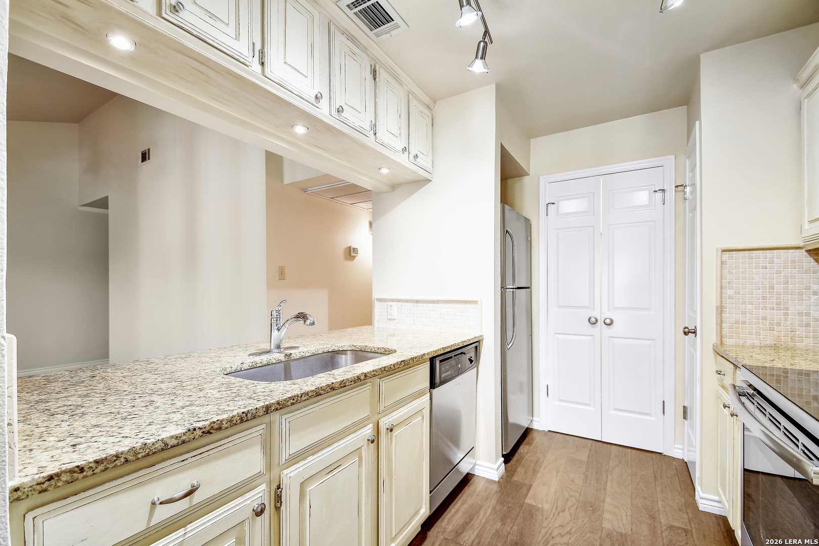 13130 Blanco Road, Unit 1706 San Antonio, TX 78216 - Photo 8 of 23 a bathroom with a sink a mirror and a shower