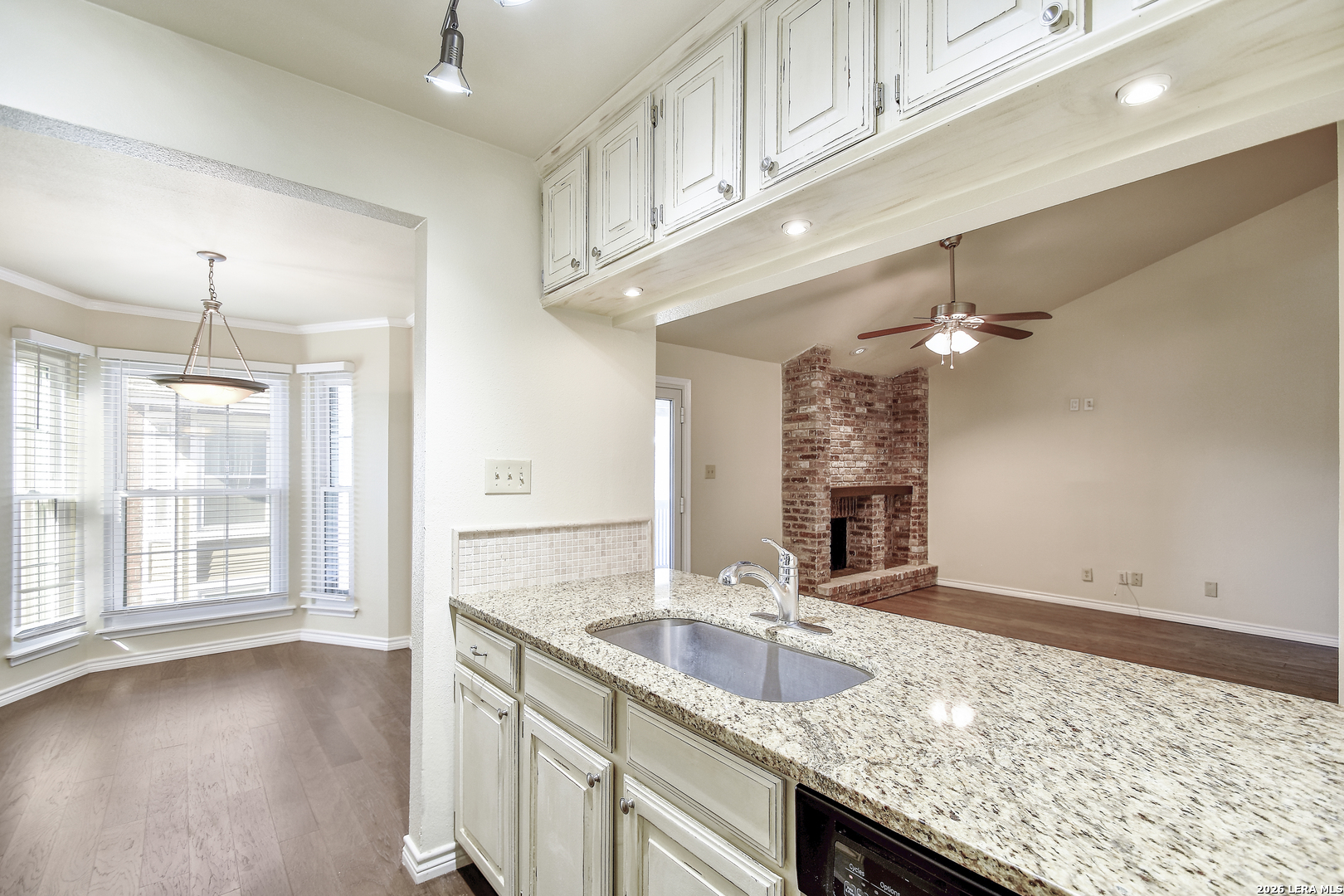 13130 Blanco Road, Unit 1706 San Antonio, TX 78216 - Photo 10 of 23 a bathroom with a granite countertop sink and a large mirror