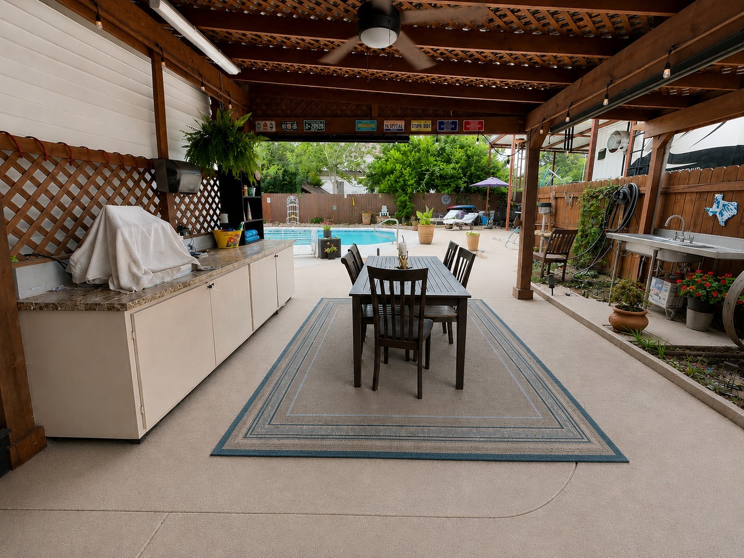 416 Division Street Jewett, TX 75846 - Photo 23 of 38 a view of a patio with dining table and chairs with a barbeque grill