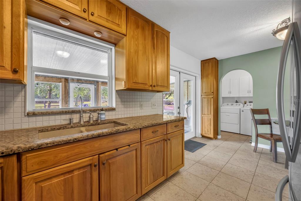 430 Cypress Isles Road Osteen, FL 32764 - Photo 16 of 55 a spacious bathroom with a sink a mirror and a bathtub