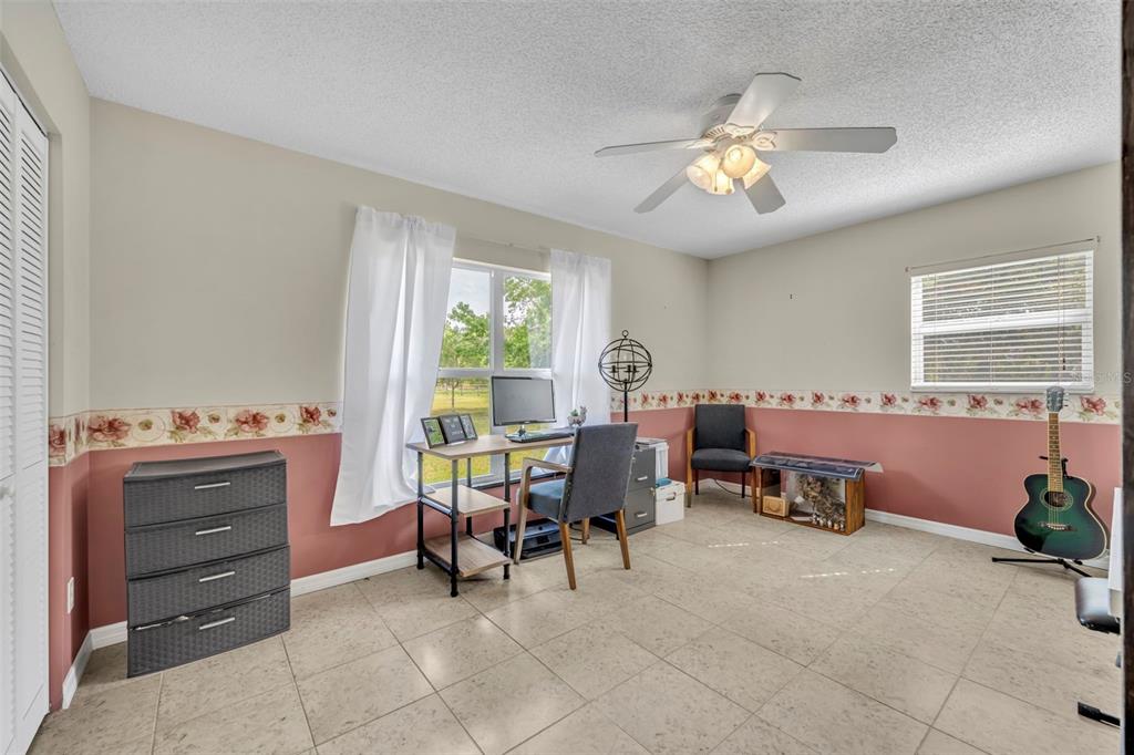 430 Cypress Isles Road Osteen, FL 32764 - Photo 20 of 55 a view of a workspace with furniture and a window