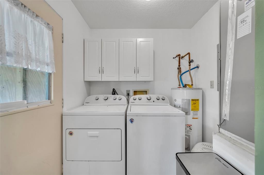 430 Cypress Isles Road Osteen, FL 32764 - Photo 26 of 55 a utility room with dryer and washer