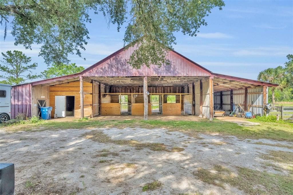 430 Cypress Isles Road Osteen, FL 32764 - Photo 34 of 55 a view of a house with a yard and plants