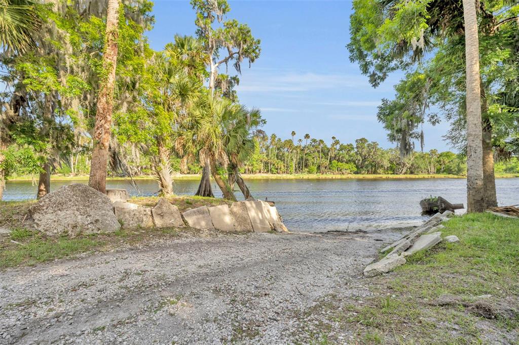 430 Cypress Isles Road Osteen, FL 32764 - Photo 49 of 55 a backyard of a house with lots of green space